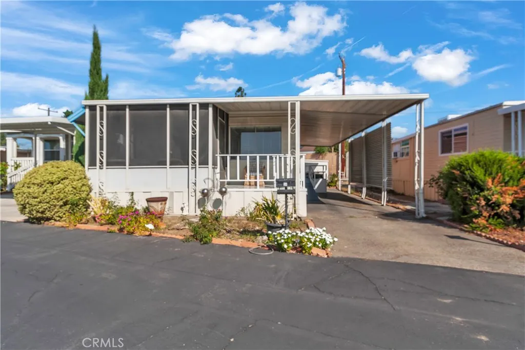 301 East Foothill Boulevard, Unit 34 Pomona, CA 91767 - Photo 1 of 35 front view of a house with a street