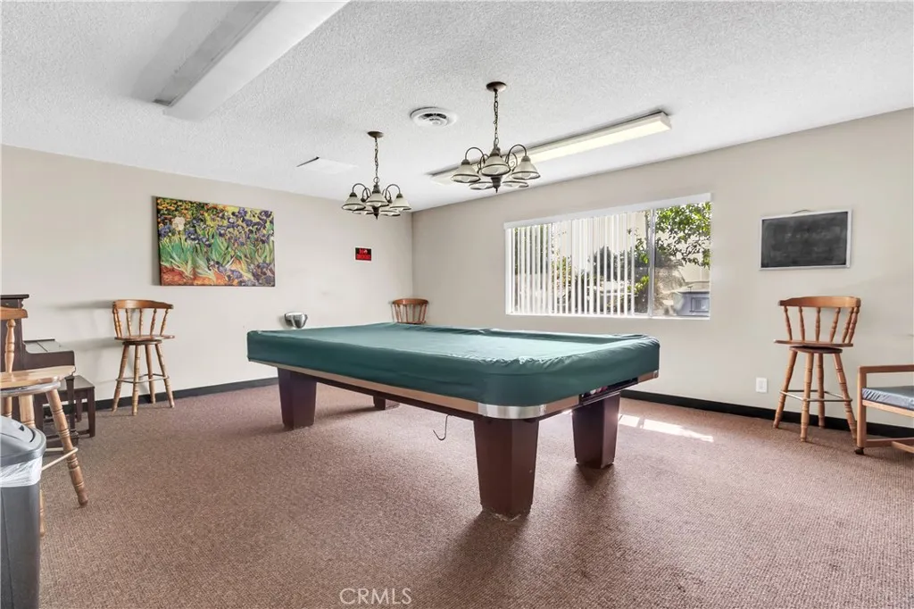 301 East Foothill Boulevard, Unit 34 Pomona, CA 91767 - Photo 22 of 35 a room with pool table and windows