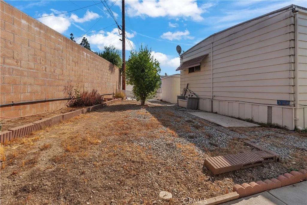 301 East Foothill Boulevard, Unit 34 Pomona, CA 91767 - Photo 34 of 35 a view of a backyard with potted plants