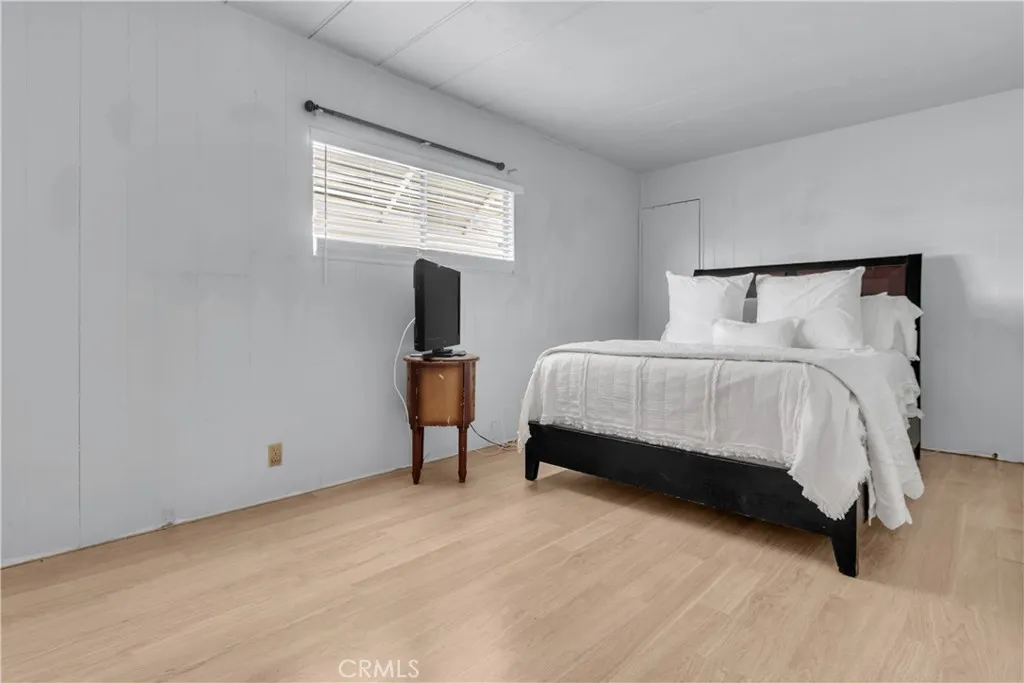 301 East Foothill Boulevard, Unit 34 Pomona, CA 91767 - Photo 5 of 35 a bed room with a bed and a window