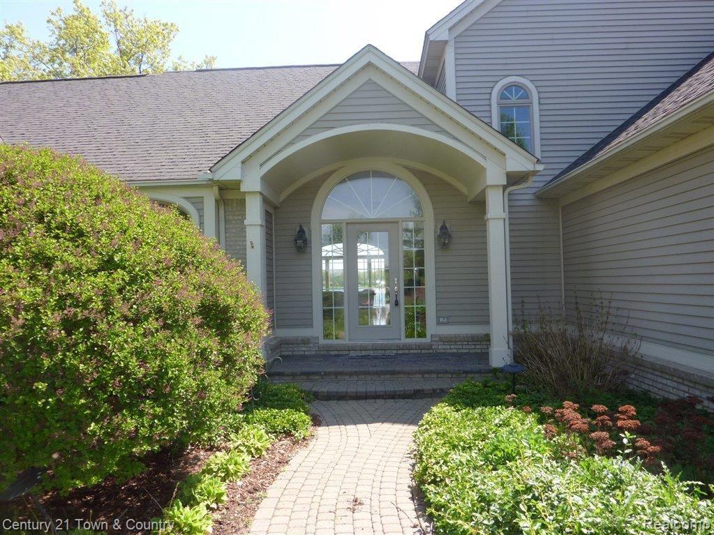 9255 Ridge Road Goodrich, MI 48438 - Photo 2 of 25 INVITING ENTRY WITH LAKE VIEWS