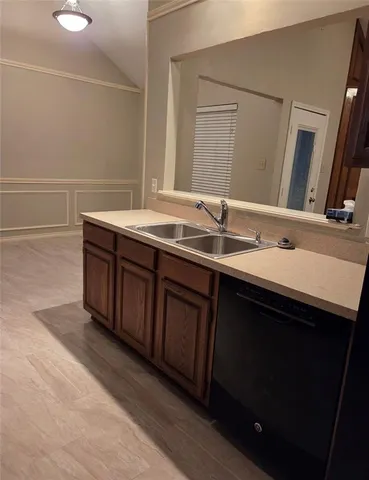 a bathroom with a double vanity sink and mirror