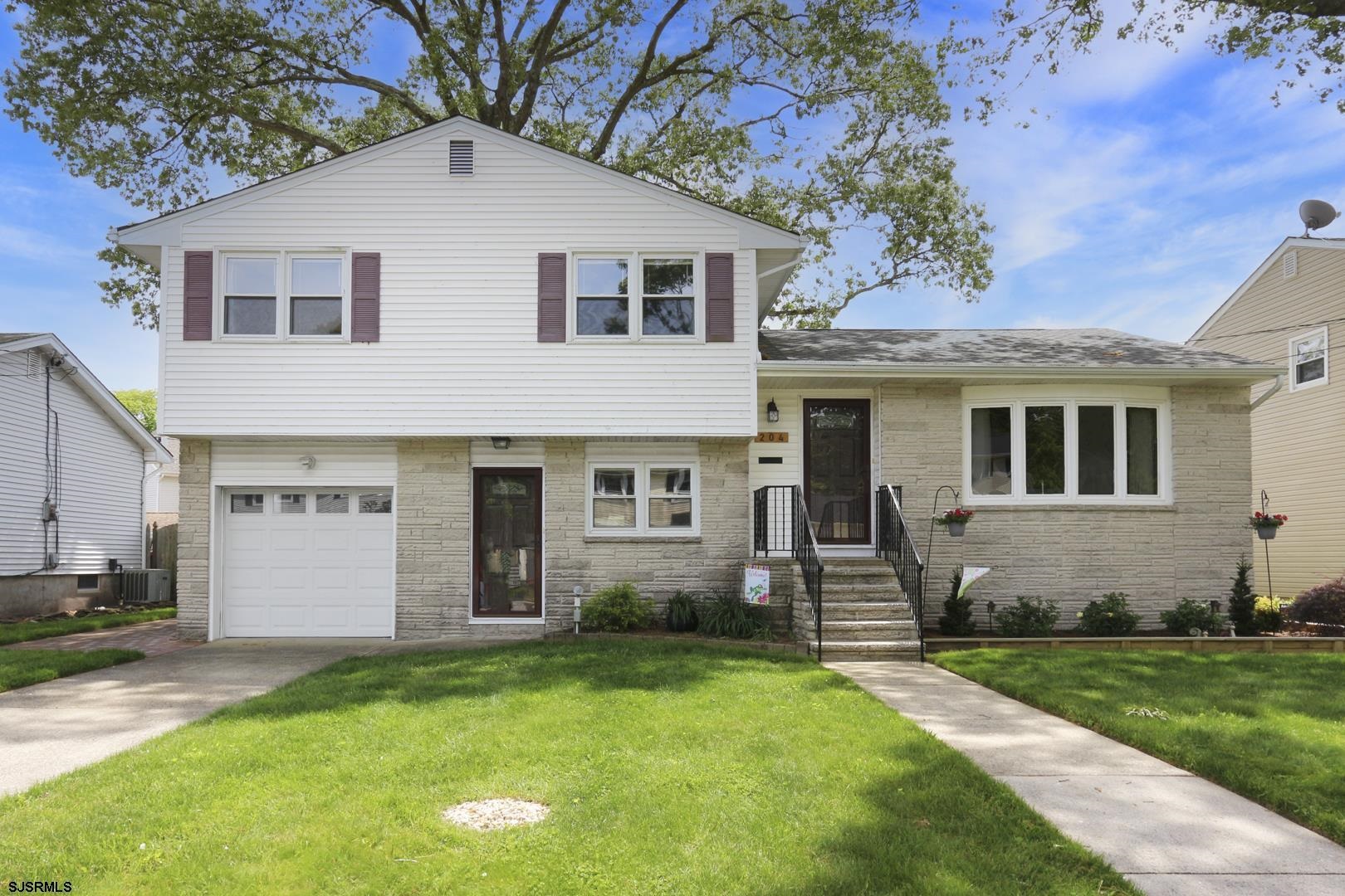 204 Bliss Avenue Somers Point, NJ 08244 - Photo 1 of 18 a front view of a house with a yard and porch