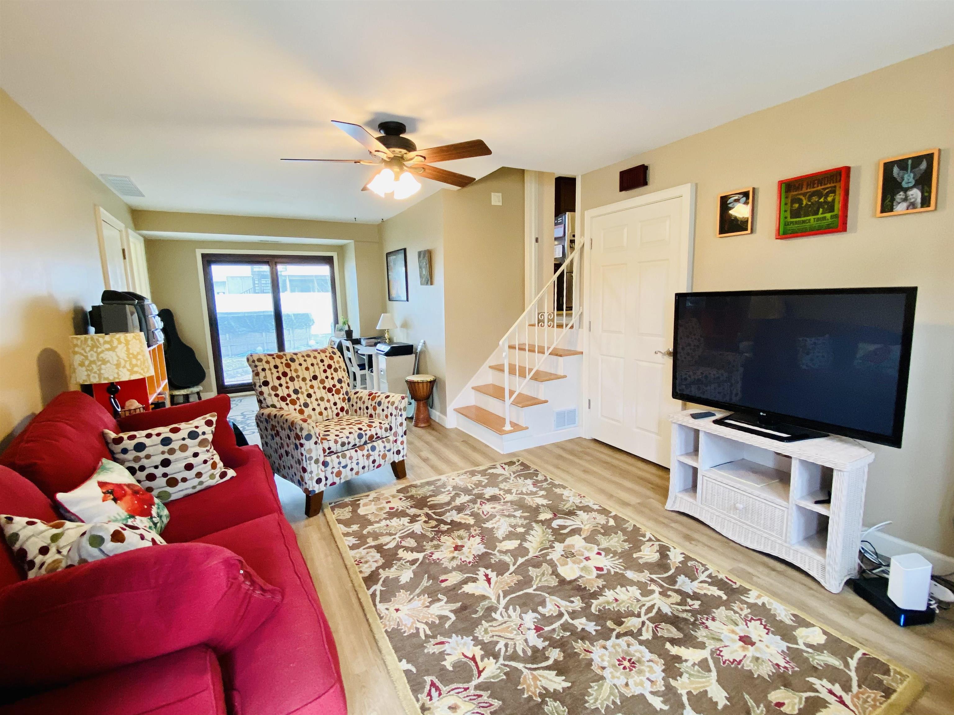 204 Bliss Avenue Somers Point, NJ 08244 - Photo 14 of 18 a living room with furniture and a flat screen tv