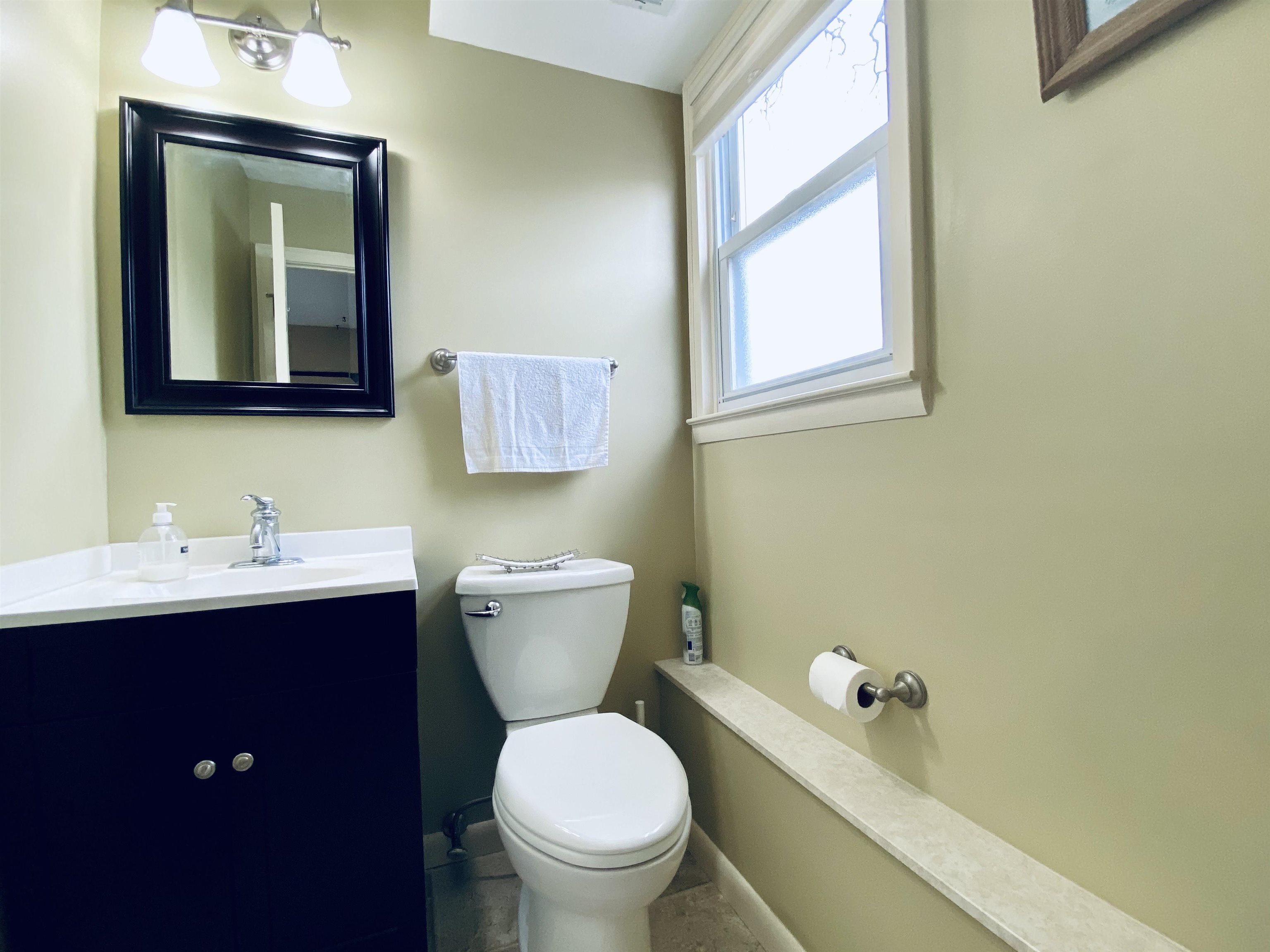 204 Bliss Avenue Somers Point, NJ 08244 - Photo 15 of 18 a bathroom with a toilet sink and mirror