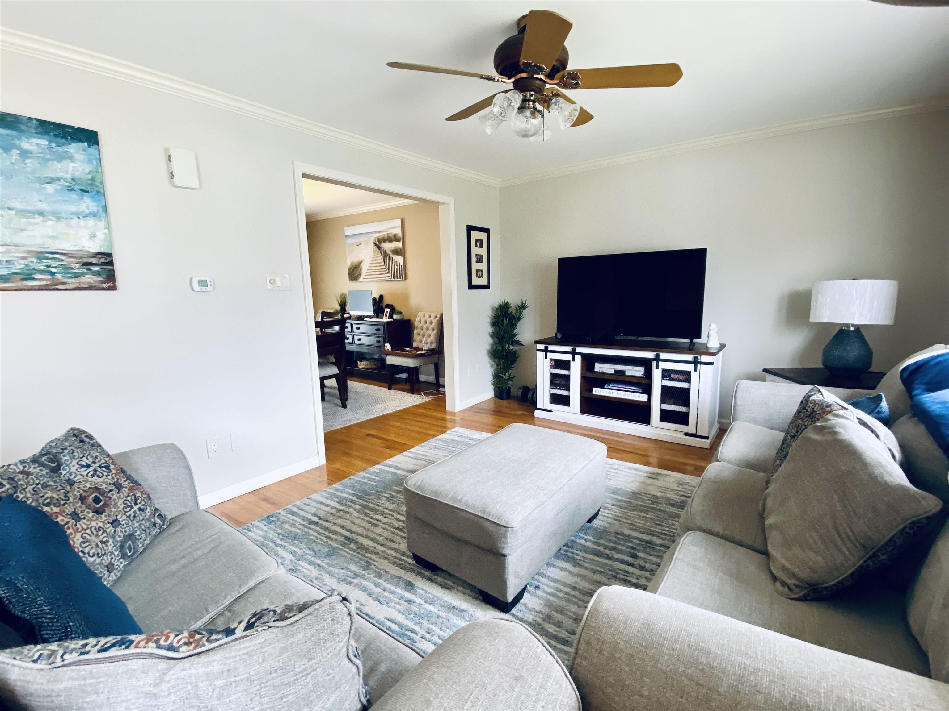 204 Bliss Avenue Somers Point, NJ 08244 - Photo 2 of 18 a living room with furniture and a flat screen tv