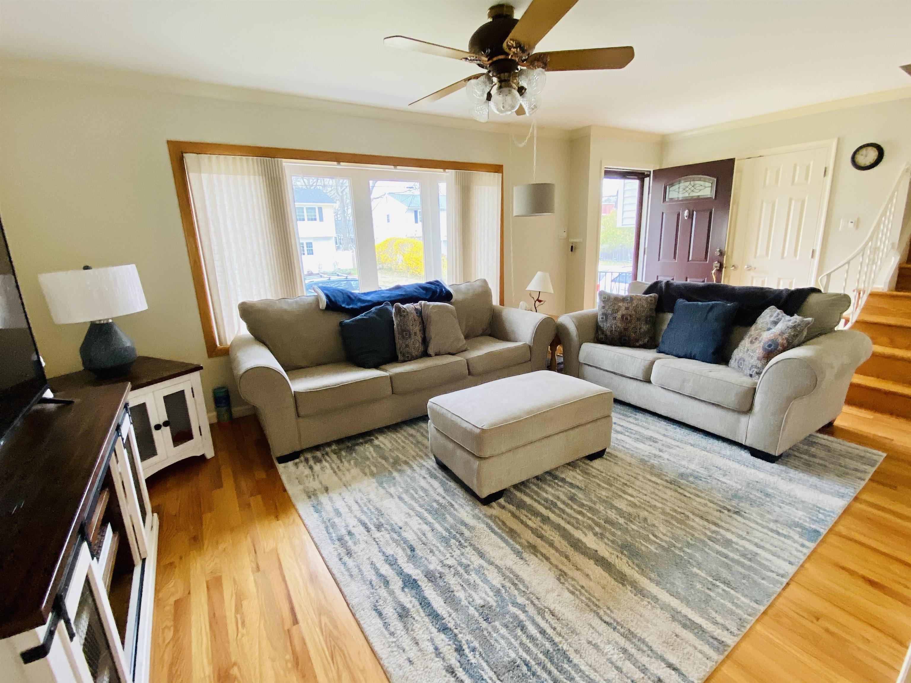 204 Bliss Avenue Somers Point, NJ 08244 - Photo 3 of 18 a living room with furniture and a wooden floor