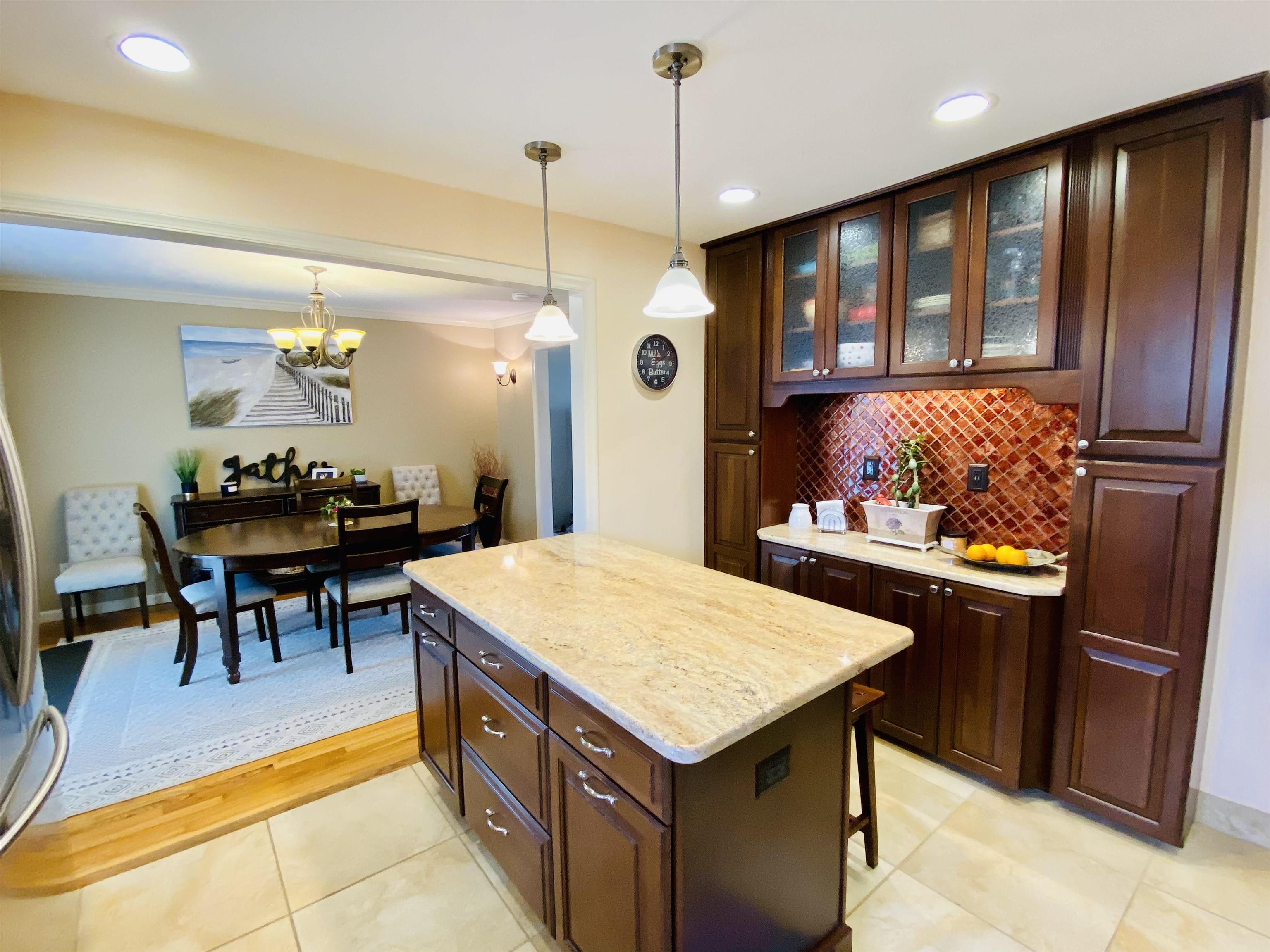204 Bliss Avenue Somers Point, NJ 08244 - Photo 9 of 18 a kitchen with a table and chairs
