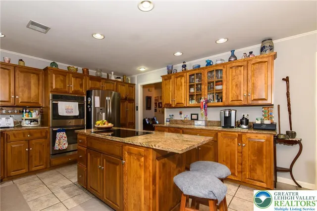 a bedroom with furniture and a large window