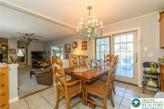 a a bathroom with a toilet a sink and a window