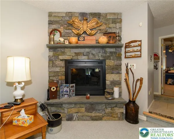 an aerial view of a house with a swimming pool patio and outdoor seating