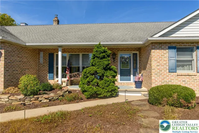 a kitchen with stainless steel appliances granite countertop a sink and a stove