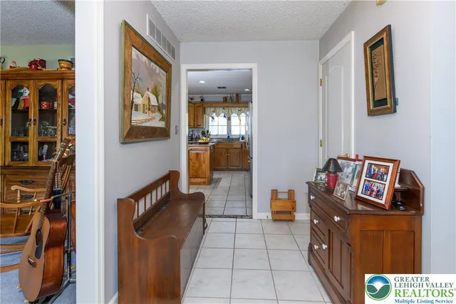 a living room with furniture and a bed