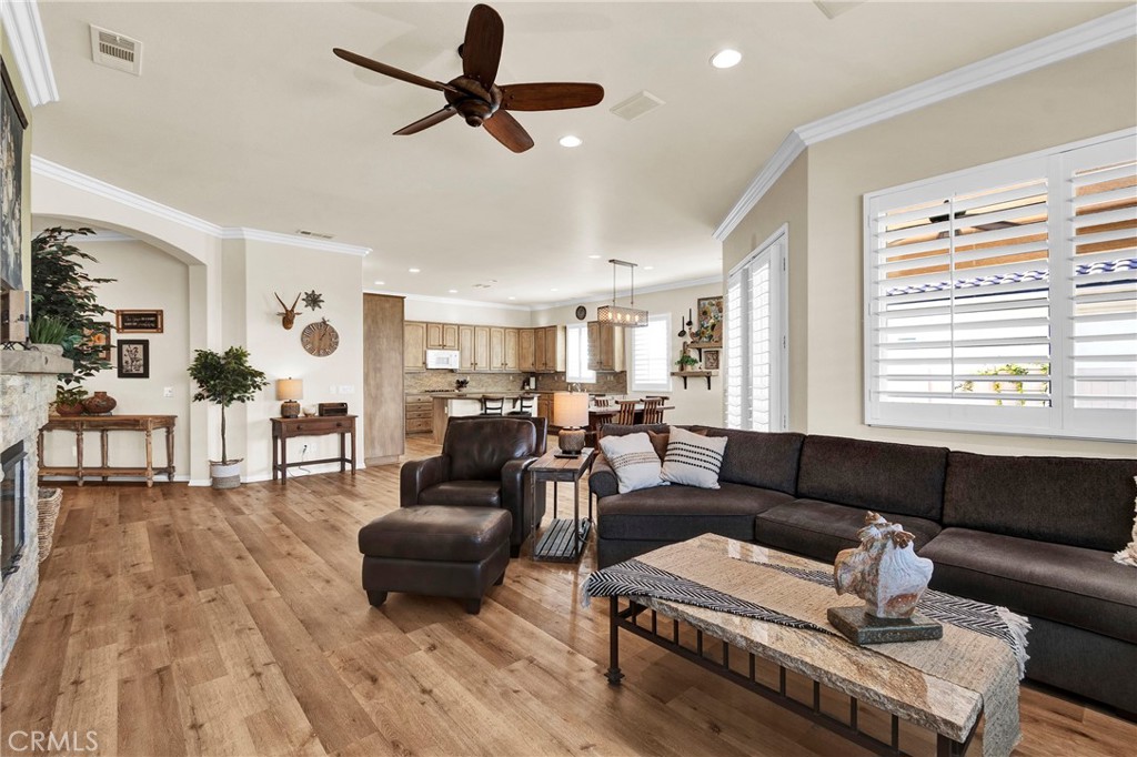 930 Gleneagles Road Beaumont, CA 92223 - Photo 12 of 40 a living room with furniture and a wooden floor