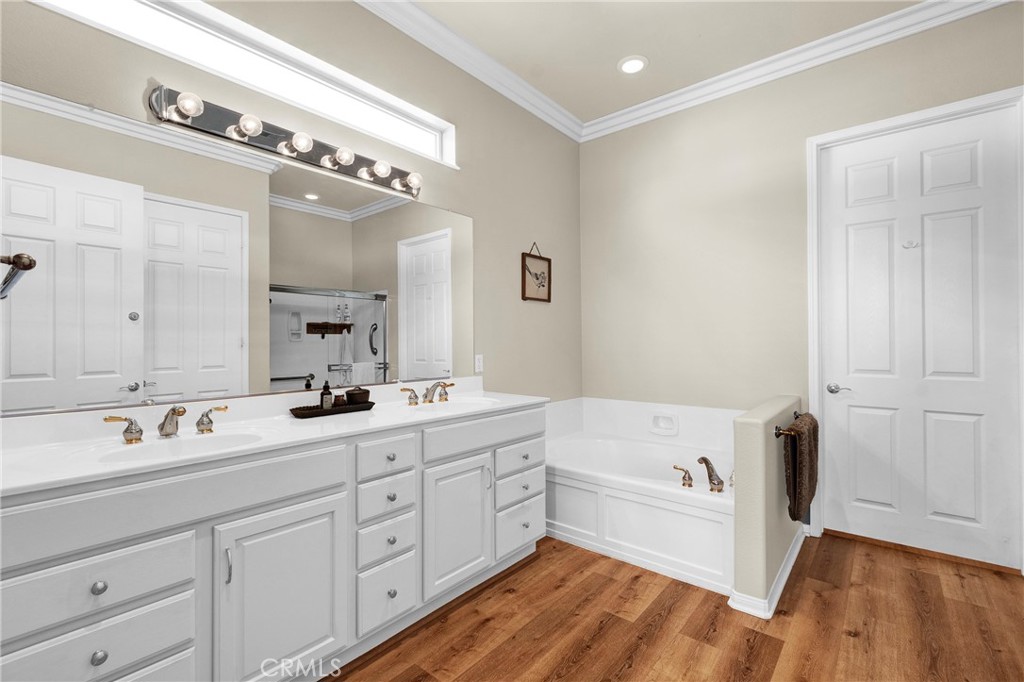 930 Gleneagles Road Beaumont, CA 92223 - Photo 21 of 40 a spacious bathroom with a tub sink and mirror