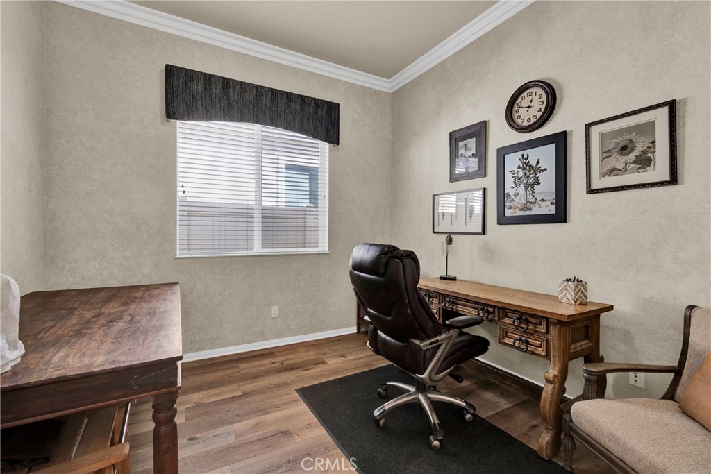 930 Gleneagles Road Beaumont, CA 92223 - Photo 24 of 40 a view of a workspace with furniture and a window