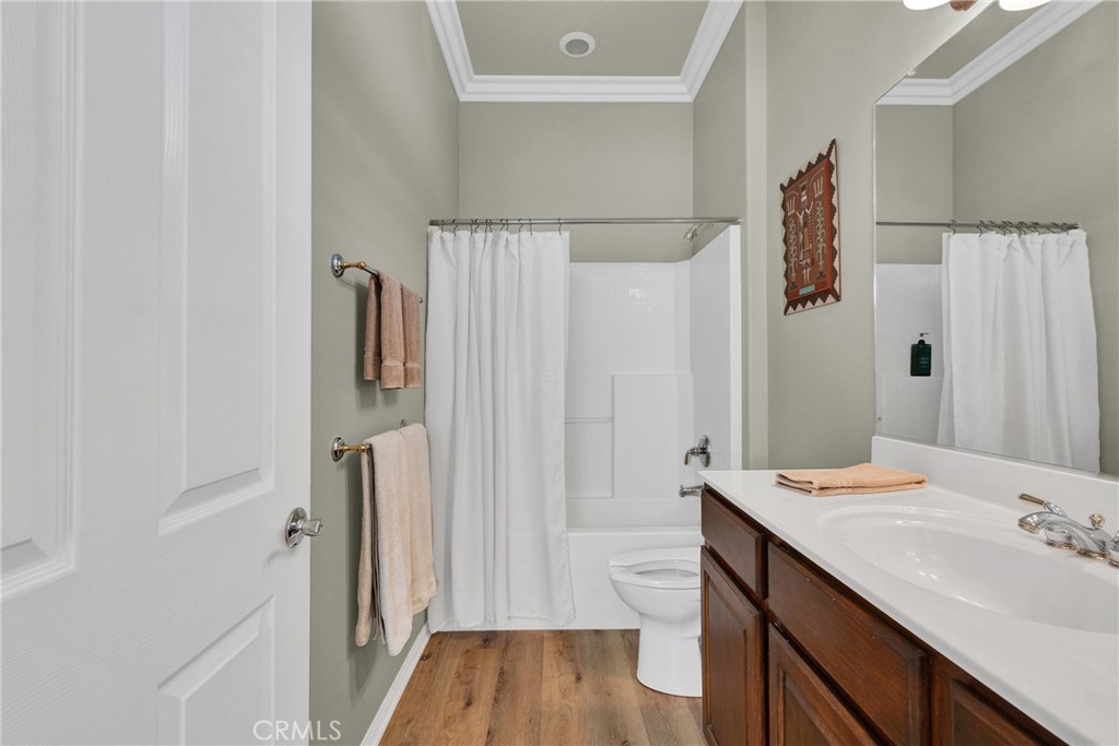 930 Gleneagles Road Beaumont, CA 92223 - Photo 28 of 40 a bathroom with a sink a toilet and shower