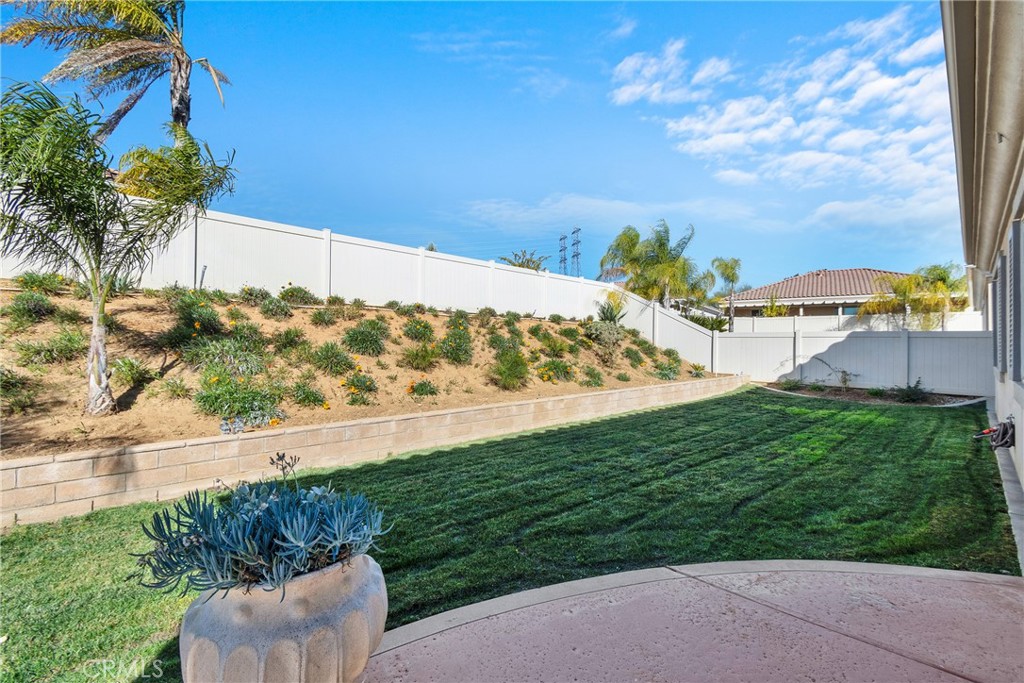 930 Gleneagles Road Beaumont, CA 92223 - Photo 32 of 40 a view of a yard with an outdoor seating
