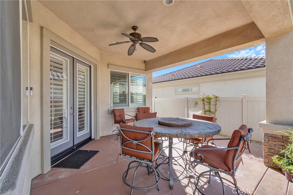 930 Gleneagles Road Beaumont, CA 92223 - Photo 33 of 40 a view of a dining room with furniture window and wooden floor