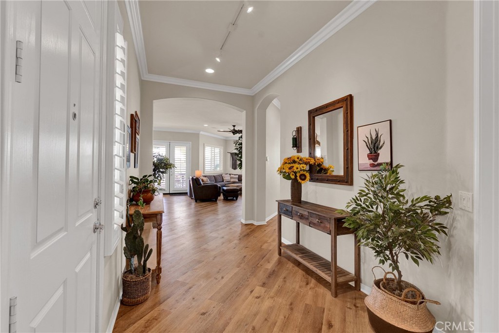 930 Gleneagles Road Beaumont, CA 92223 - Photo 7 of 40 a living room with furniture and a potted plant