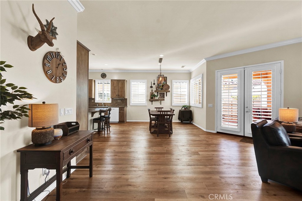 930 Gleneagles Road Beaumont, CA 92223 - Photo 9 of 40 a living room with furniture and wooden floor
