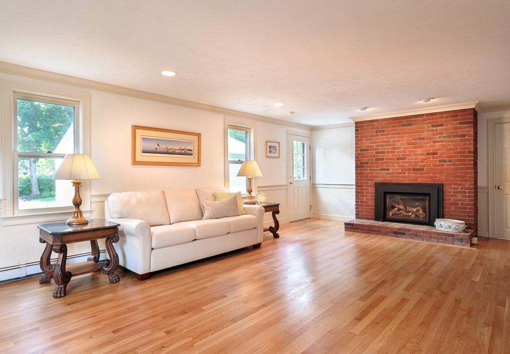 40 Upland Road Duxbury, MA 02332 - Photo 12 of 38 a living room with furniture and a fireplace