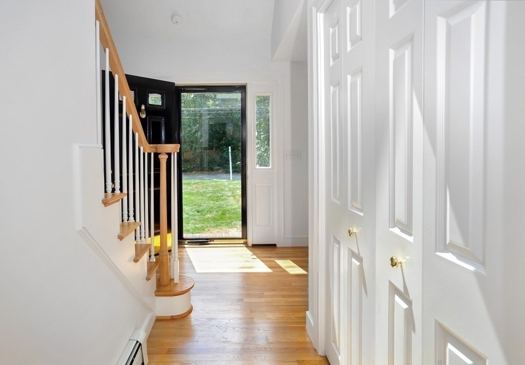 40 Upland Road Duxbury, MA 02332 - Photo 19 of 38 a view of entryway with wooden floor and windows