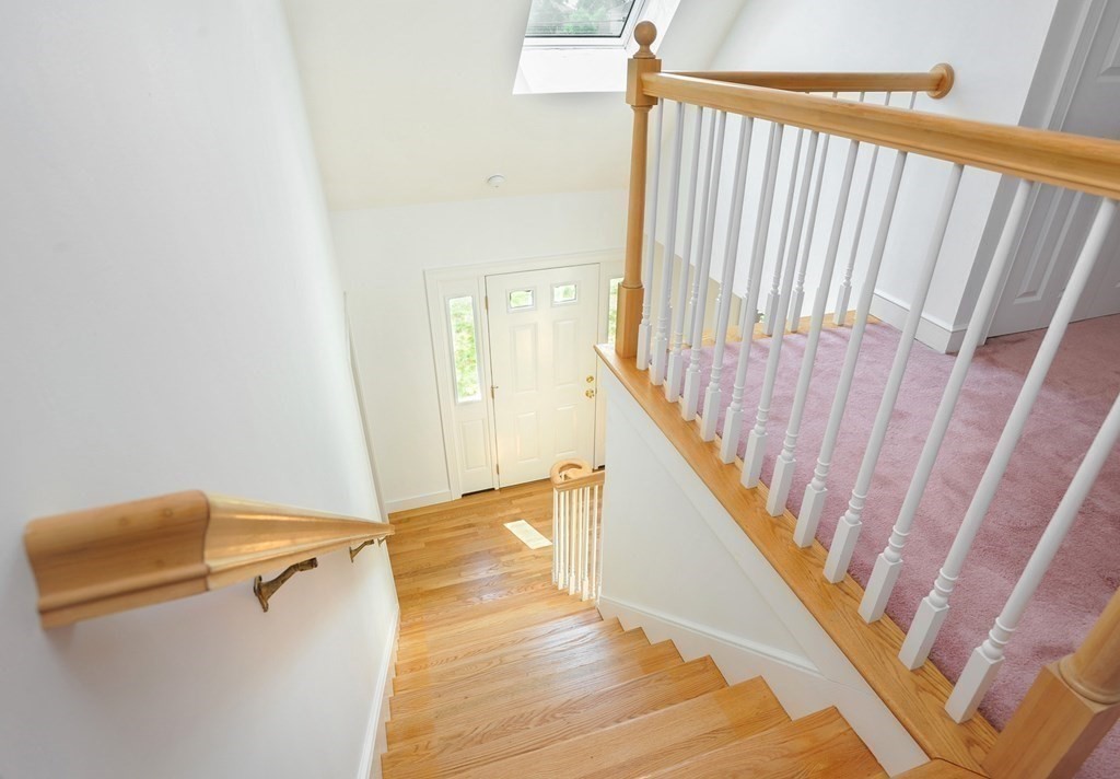 40 Upland Road Duxbury, MA 02332 - Photo 20 of 38 a view of staircase with white walls and a window
