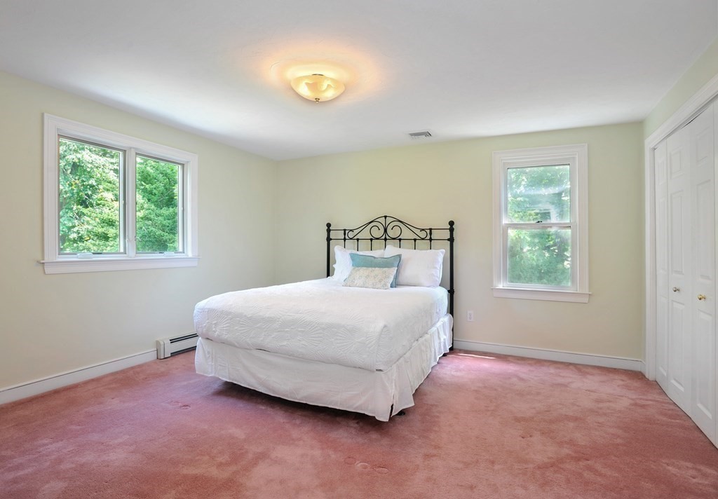 40 Upland Road Duxbury, MA 02332 - Photo 21 of 38 a bedroom with a bed and a window