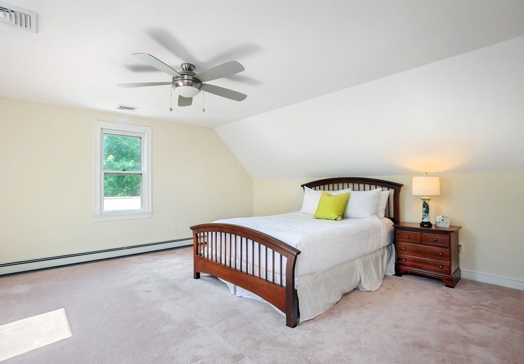 40 Upland Road Duxbury, MA 02332 - Photo 22 of 38 a spacious bedroom with a bed and a window