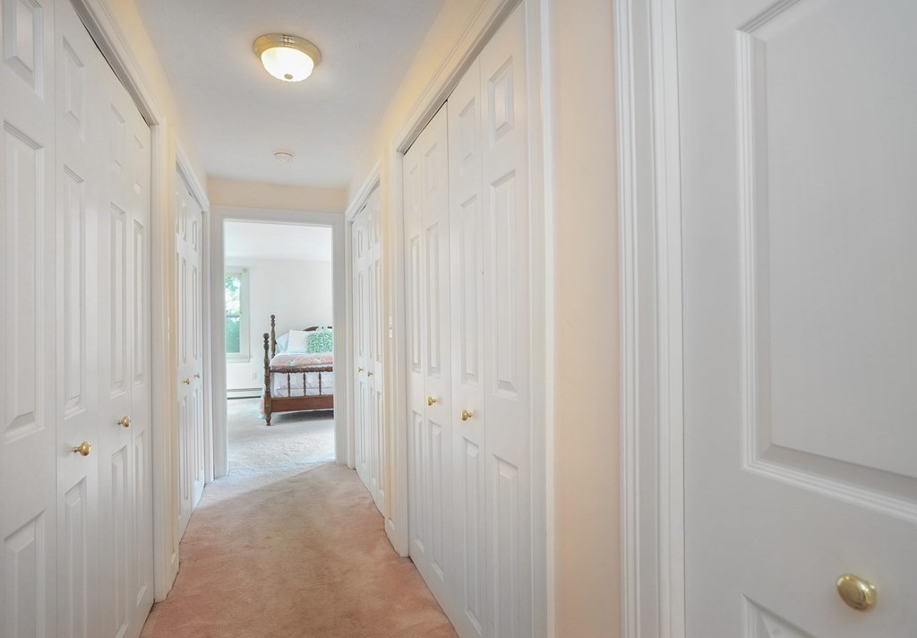 40 Upland Road Duxbury, MA 02332 - Photo 24 of 38 a view of a bedroom from a hallway