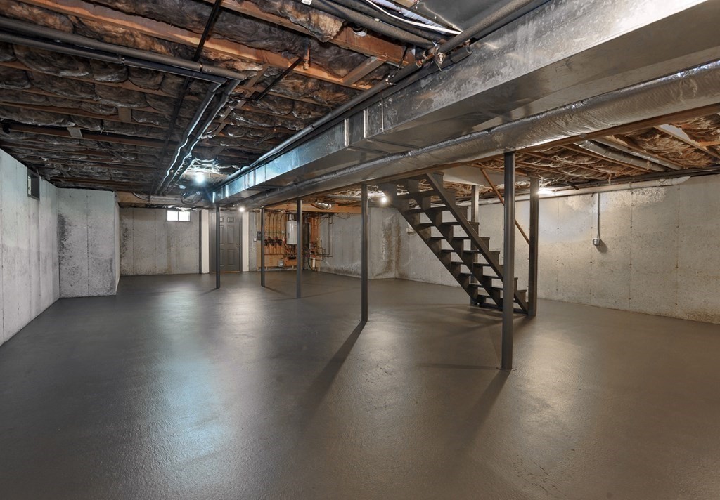 40 Upland Road Duxbury, MA 02332 - Photo 33 of 38 a view of an empty room with wooden floor
