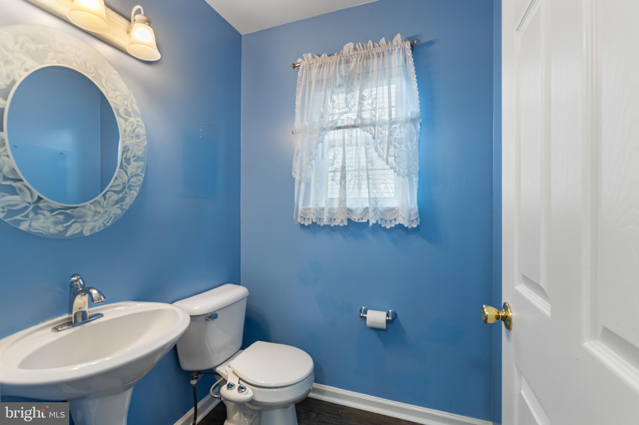 2 Kerrin Road Bear, DE 19701 - Photo 12 of 29 a bathroom with a toilet a sink and mirror