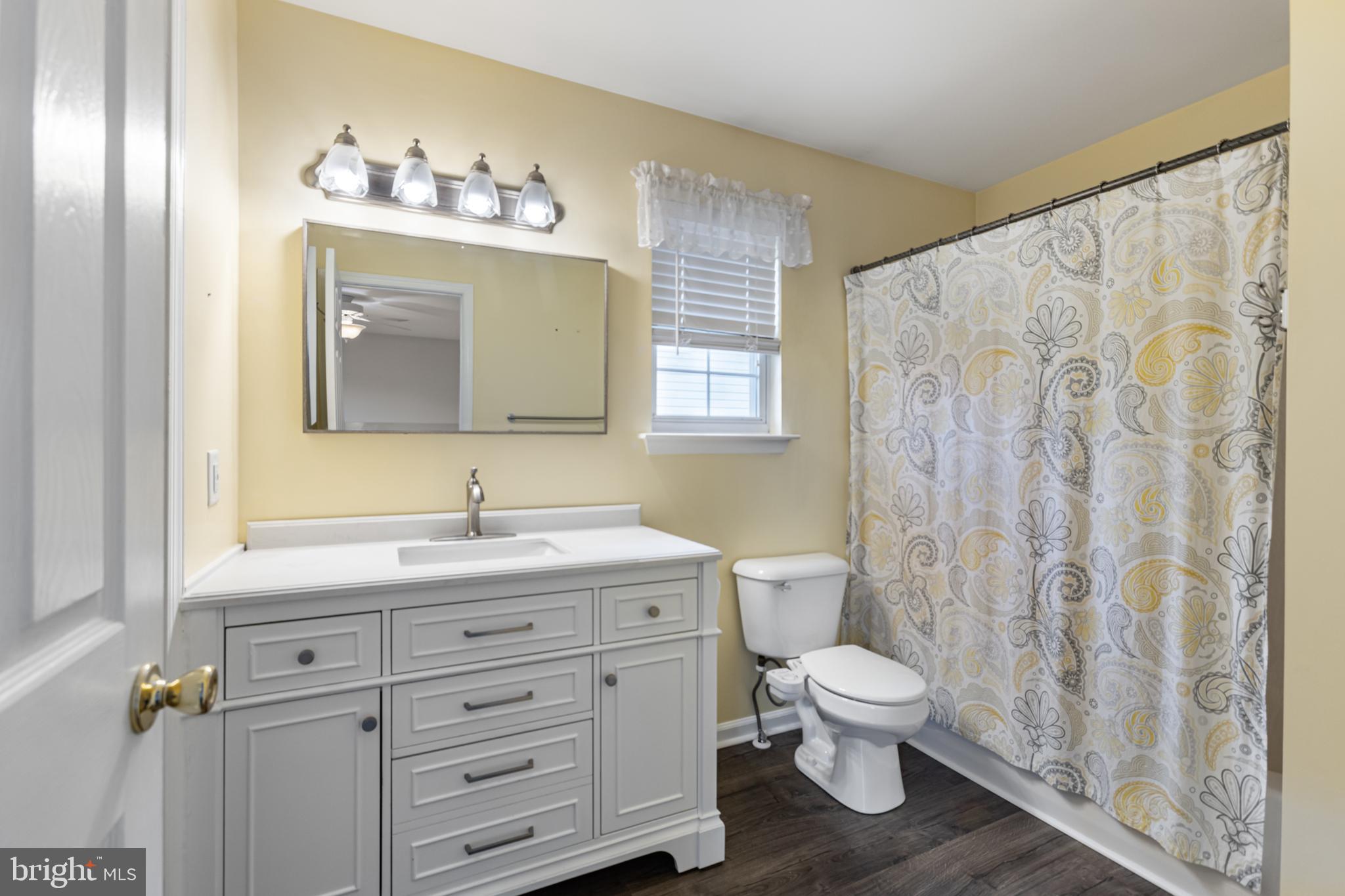 2 Kerrin Road Bear, DE 19701 - Photo 15 of 29 a bathroom with a toilet a sink and a mirror