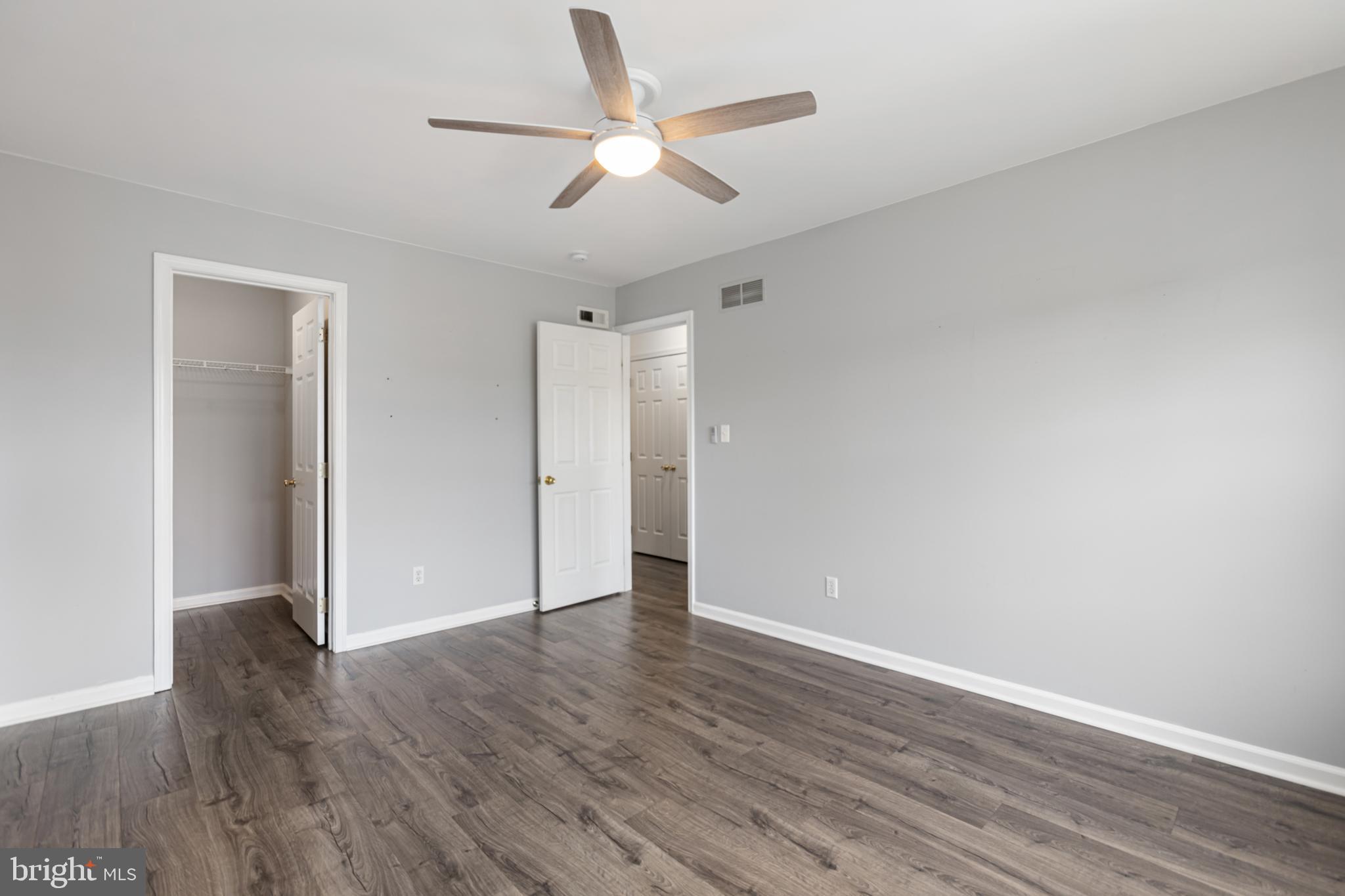 2 Kerrin Road Bear, DE 19701 - Photo 21 of 29 an empty room with wooden floor and a ceiling fan