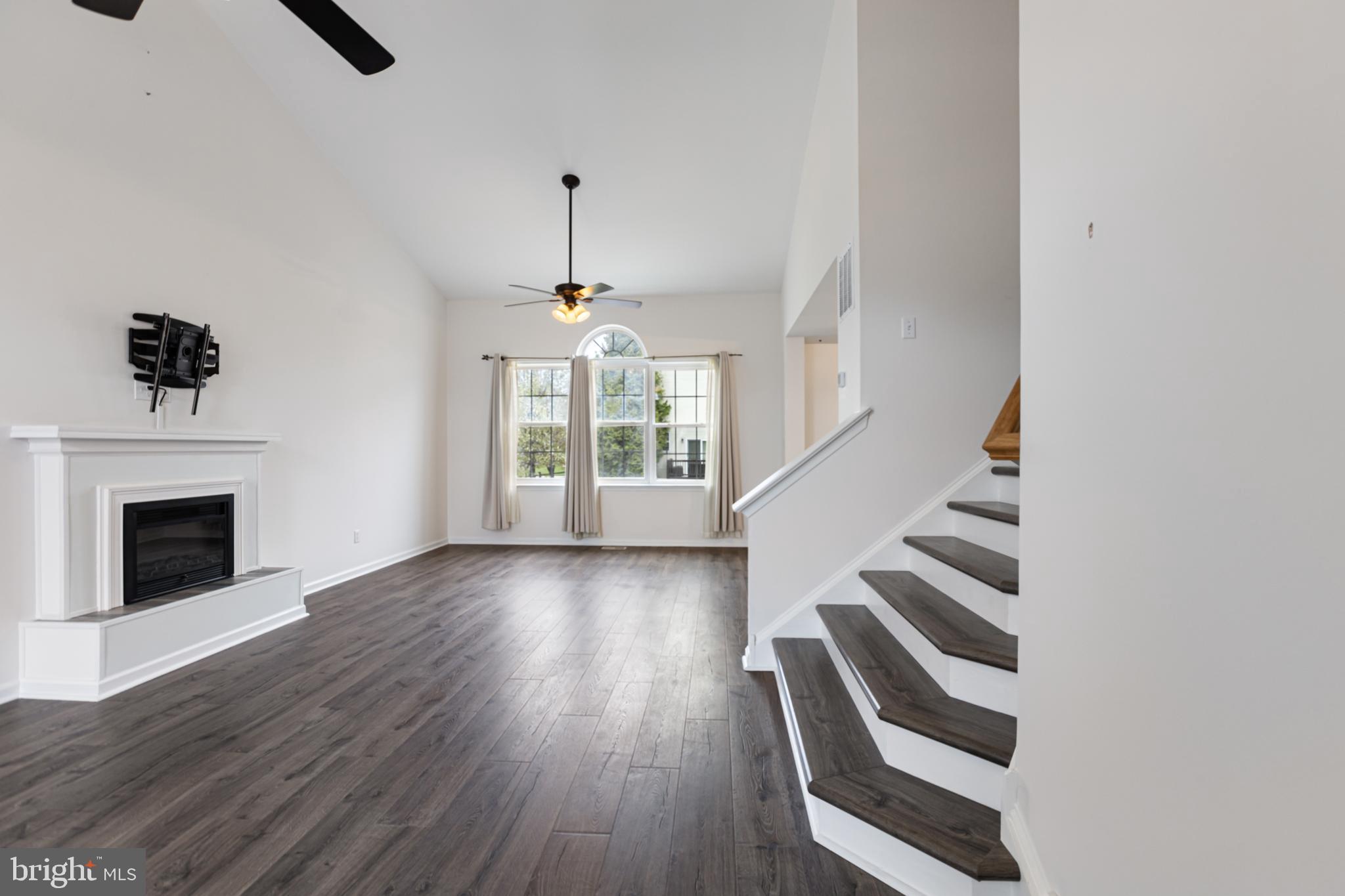 2 Kerrin Road Bear, DE 19701 - Photo 4 of 29 wooden floor in an empty room with a fireplace