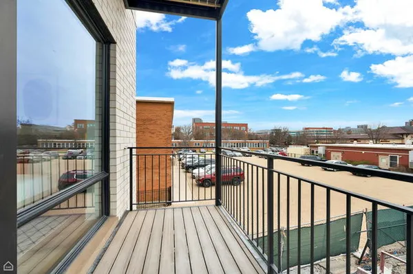 a view of a balcony with wooden floor
