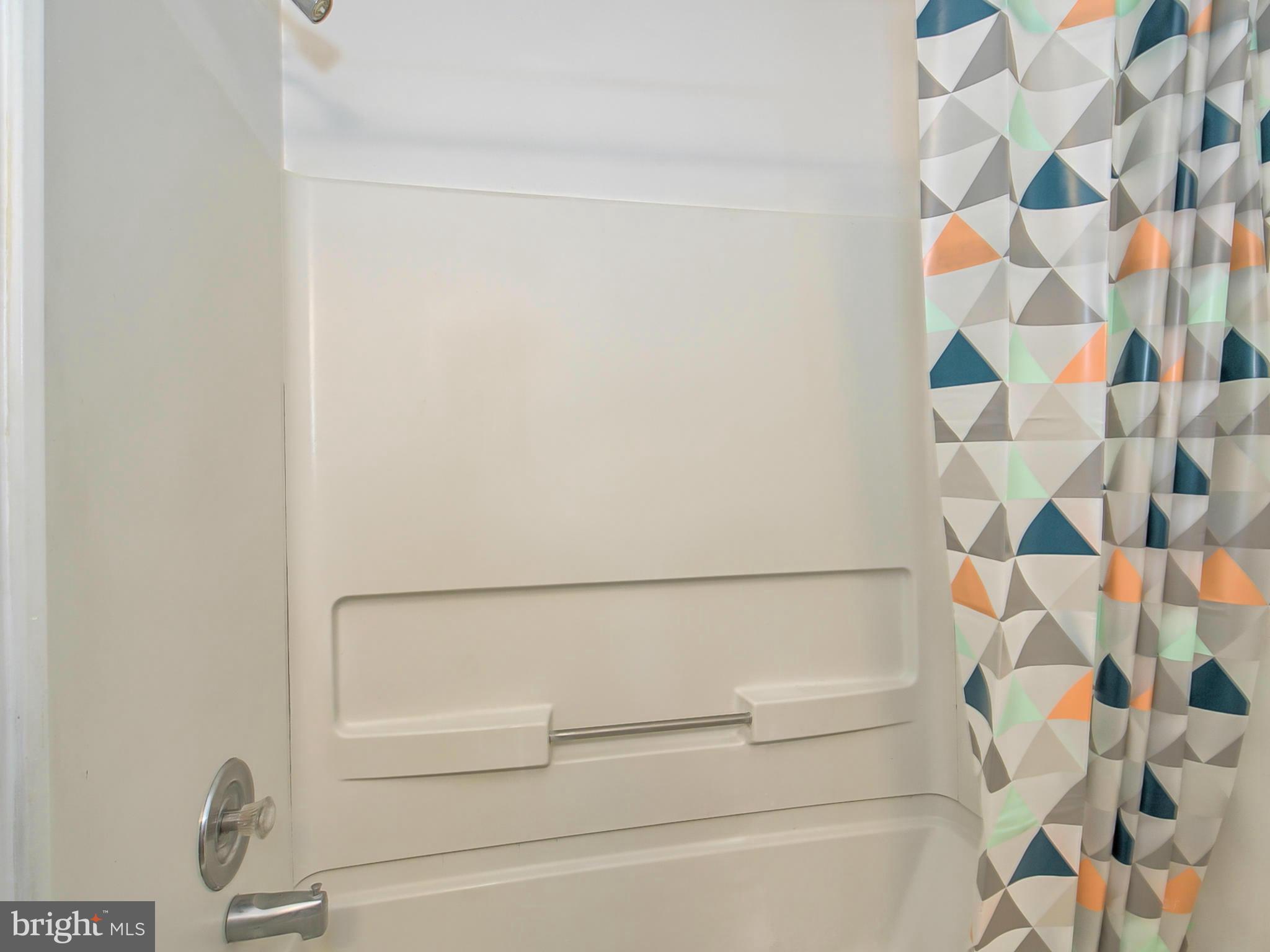 2137 Wainwright Court, Unit 2B Frederick, MD 21702 - Photo 23 of 30 a bathroom with a bathtub and a shower