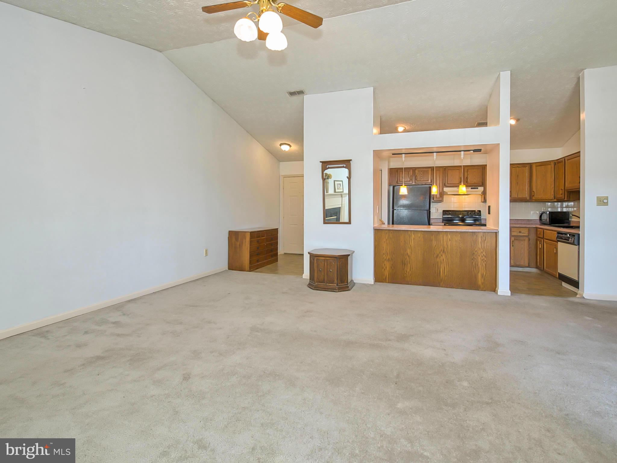2137 Wainwright Court, Unit 2B Frederick, MD 21702 - Photo 5 of 30 a view of an empty room with a kitchen