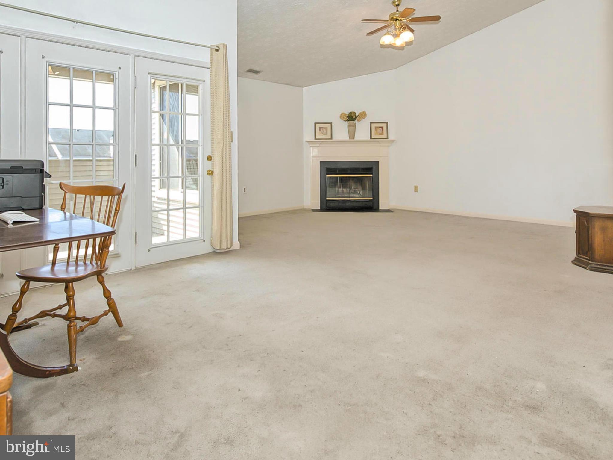 2137 Wainwright Court, Unit 2B Frederick, MD 21702 - Photo 7 of 30 a view of livingroom with furniture and a fireplace