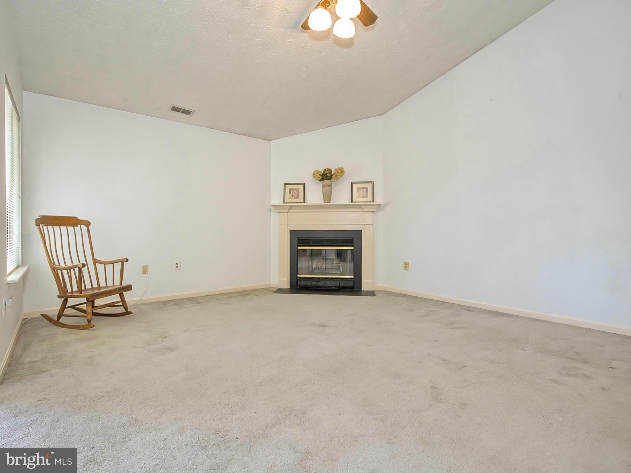 2137 Wainwright Court, Unit 2B Frederick, MD 21702 - Photo 9 of 30 a view of an empty room with a fireplace