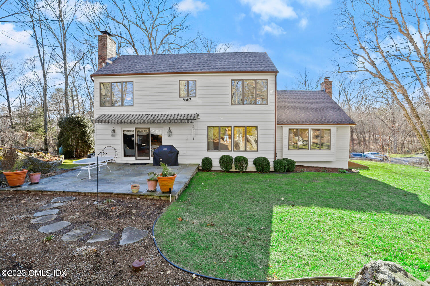445 Cognewaugh Road Cos Cob, CT 06807 - Photo 33 of 61 front view of a house with a yard