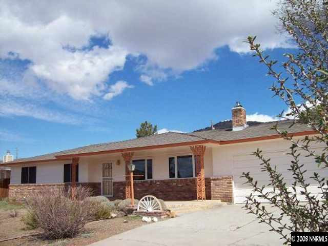 14580 Chamy Drive Reno, NV 89521 - Photo 1 of 9 a front view of a house with a yard