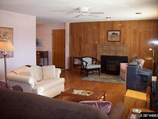 14580 Chamy Drive Reno, NV 89521 - Photo 2 of 9 a living room with furniture rug and wooden floor