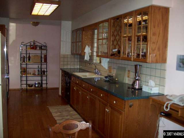 14580 Chamy Drive Reno, NV 89521 - Photo 4 of 9 a kitchen with sink and cabinets