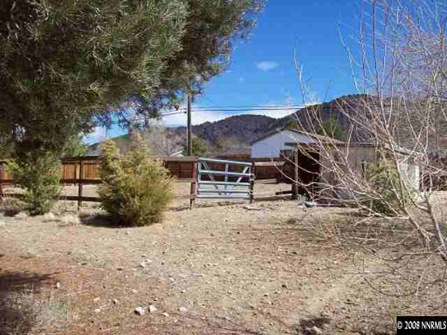 14580 Chamy Drive Reno, NV 89521 - Photo 9 of 9 a view of a backyard with wooden fence