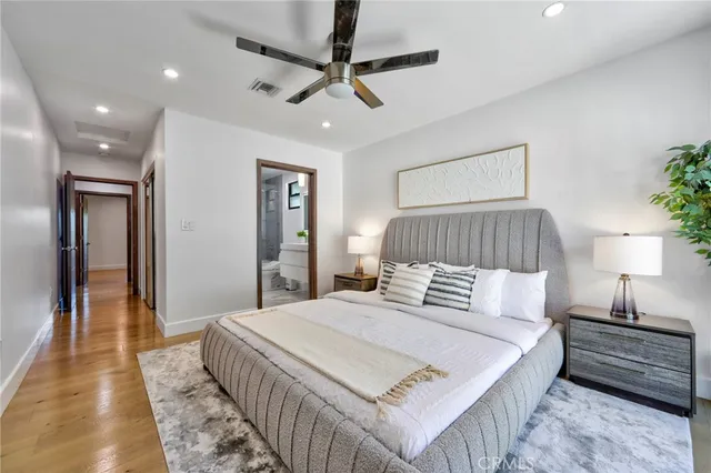 a bedroom with a bed and a lamp