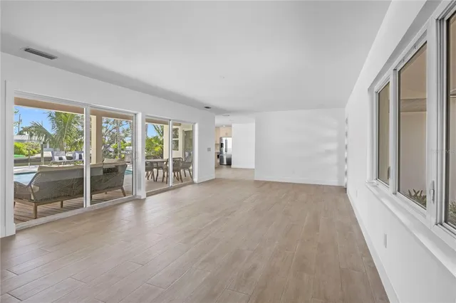 a kitchen with stainless steel appliances a sink a stove a refrigerator and cabinets