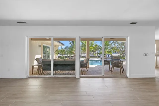 a view of a large dining room with furniture window and outside view