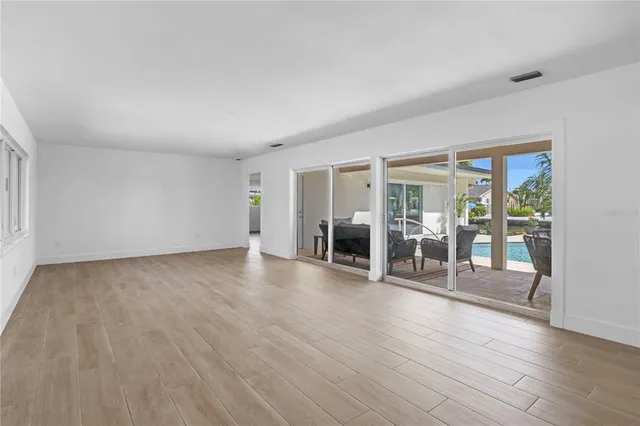 a kitchen with a refrigerator a sink and a stove top oven